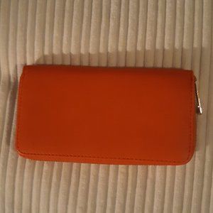 medium size Orange zip up wallet  by an off brand